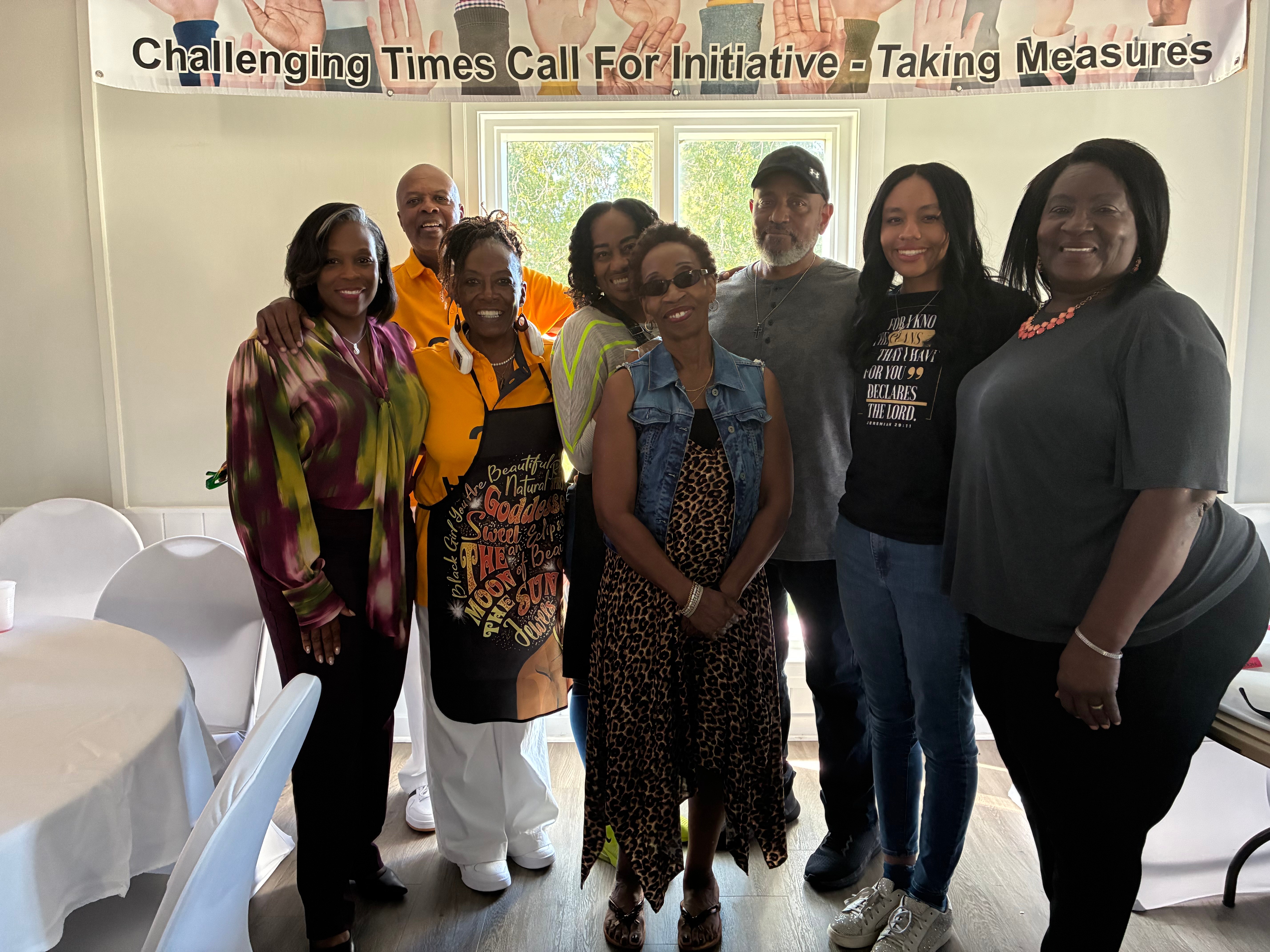 Community leaders and Mayor at Food Fest 2025 under Challenging Times banner