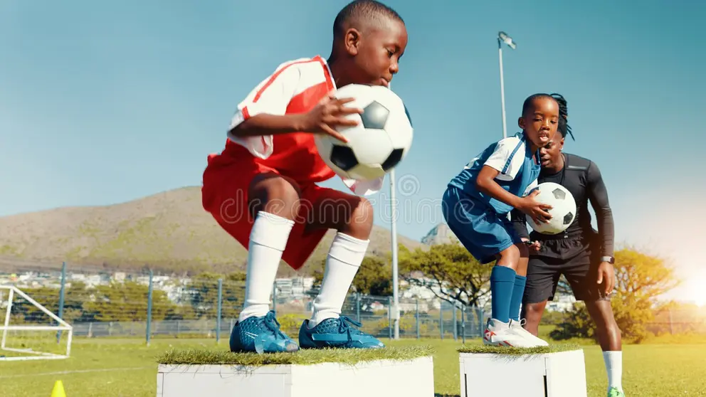 Young athletes training with soccer balls, showcasing 22 Hands Up LLC's commitment to youth sports and physical wellness programs